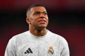 Real Madrid’s Kylian Mbappe warms up prior the Spanish La Liga soccer match between Athletic Bilbao and Real Madrid at the San Mames stadium in Bilbao, Spain, Wednesday, Dec. 4, 2024. (AP Photo/Miguel Oses)