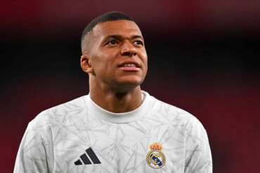 Real Madrid’s Kylian Mbappe warms up prior the Spanish La Liga soccer match between Athletic Bilbao and Real Madrid at the San Mames stadium in Bilbao, Spain, Wednesday, Dec. 4, 2024. (AP Photo/Miguel Oses)