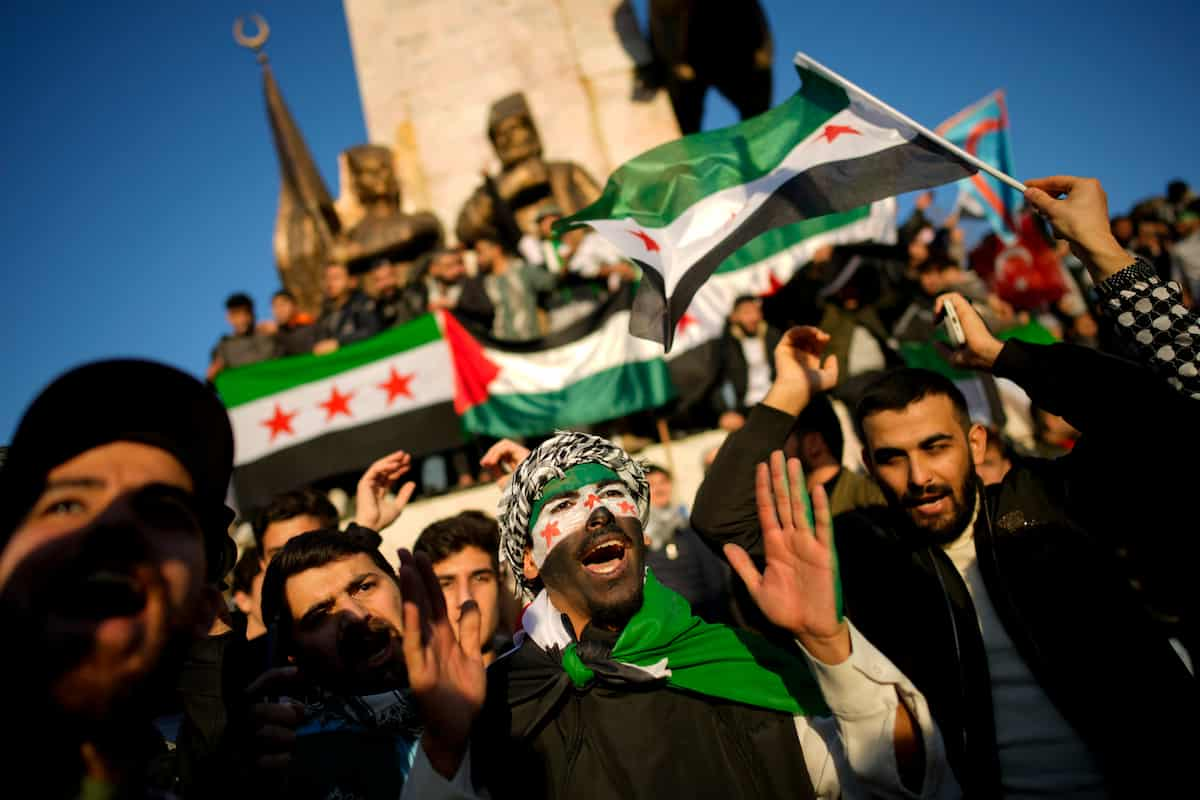 People gather to celebrate the Syrian government fall, in Istanbul, Turkey, Sunday, Dec. 8, 2024. (AP Photo/Emrah Gurel)