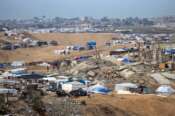 A tent camp for displaced Palestinians is set up amid destroyed buildings in the Khan Younis refugee camp, southern Gaza Strip, Saturday, Jan. 4, 2025. (AP Photo/Abdel Kareem Hana) Associated Press / LaPresse Only italy and Spain