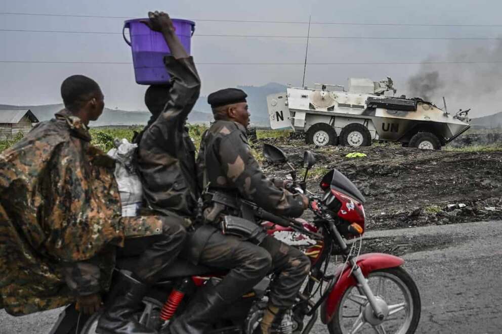 A UN armoured personnel carrier burns during clashes with M23 rebels outside Goma, Democratic Republic of the Congo, Saturday, Jan. 25, 2024. (AP Photo/Moses Sawasawa)